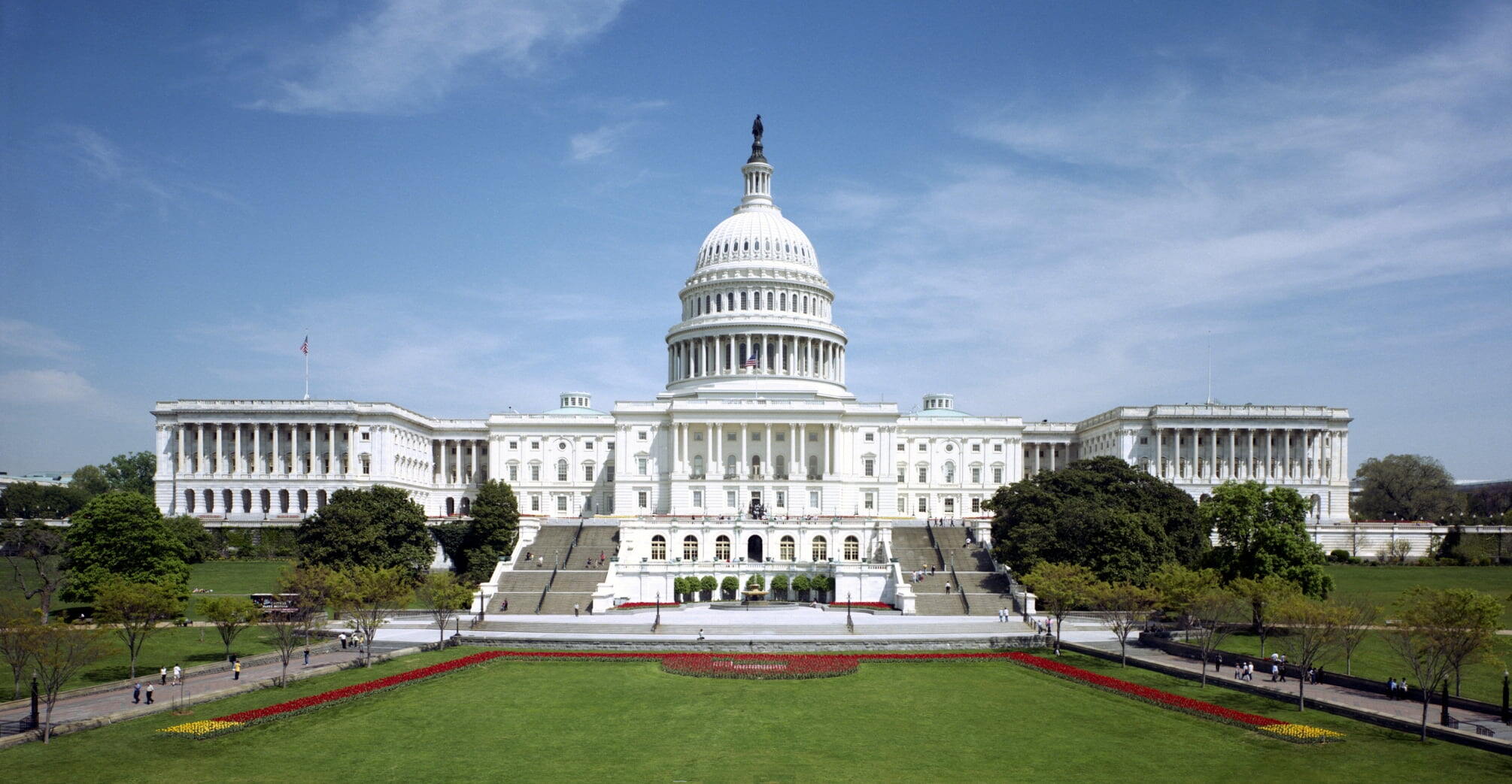 Washington - The western front of the United States Capitol. The Neoclassical style building is in Washington, D.C., on Capitol Hill, at the east end of the National Mall. The Capitol was designated a National Historic Landmark in 1960.