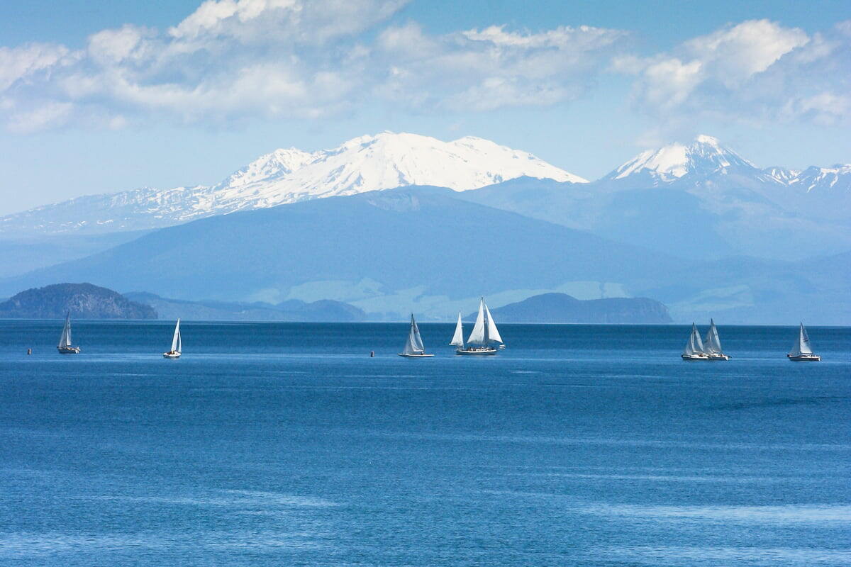 Taupo - Yachts sailing on Lake Taupo, with the snow caped Mount Ruapehu in the Back Ground.