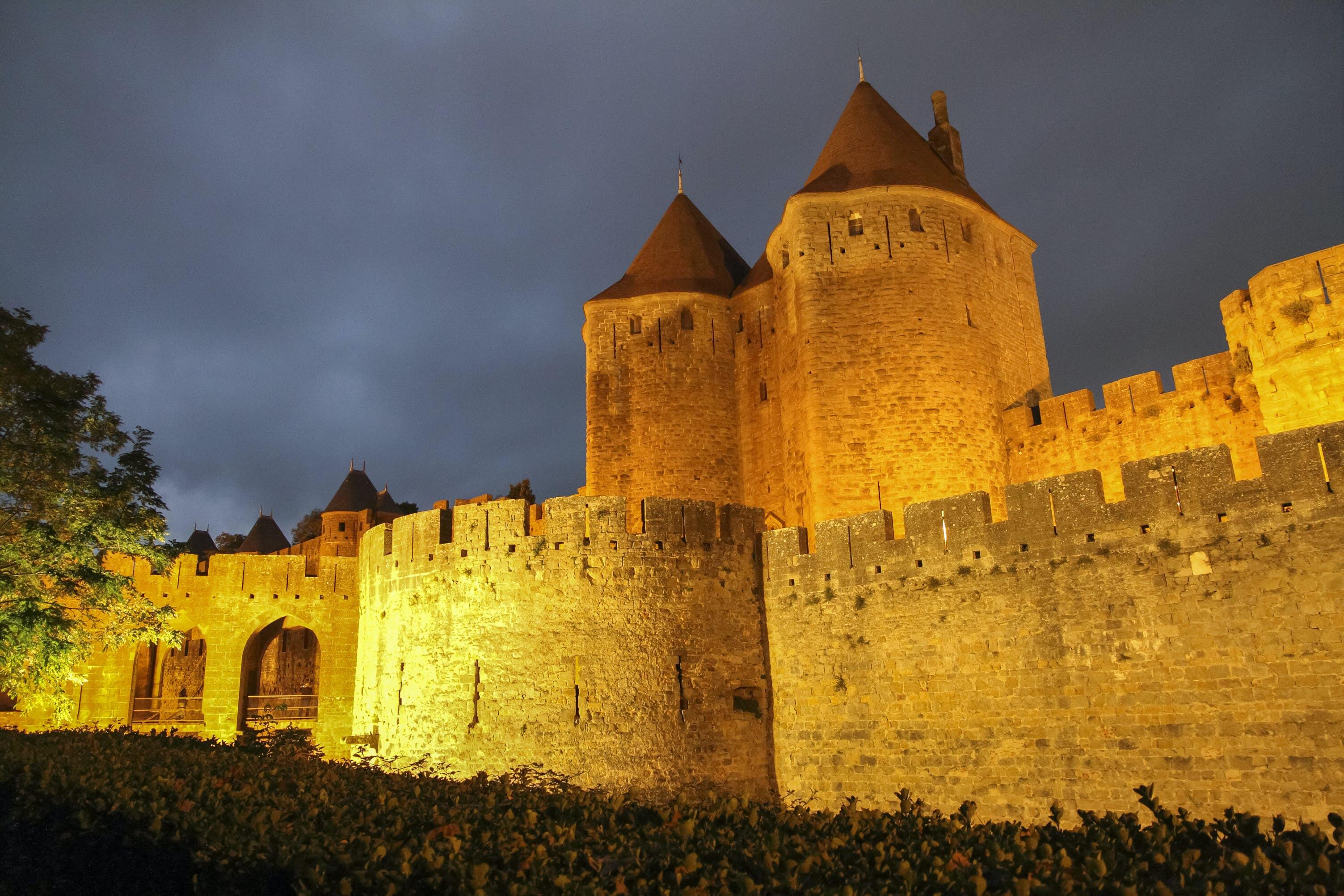 Remparts at dusk, Carcassonne, Languedoc-Roussillon, France on October 9, 2014; Shutterstock ID 578464048; Your name (First / Last): Daniel Fahey; GL account no.: 65050; Netsuite department name: Online Editorial; Full Product or Project name including edition: La Cité POI