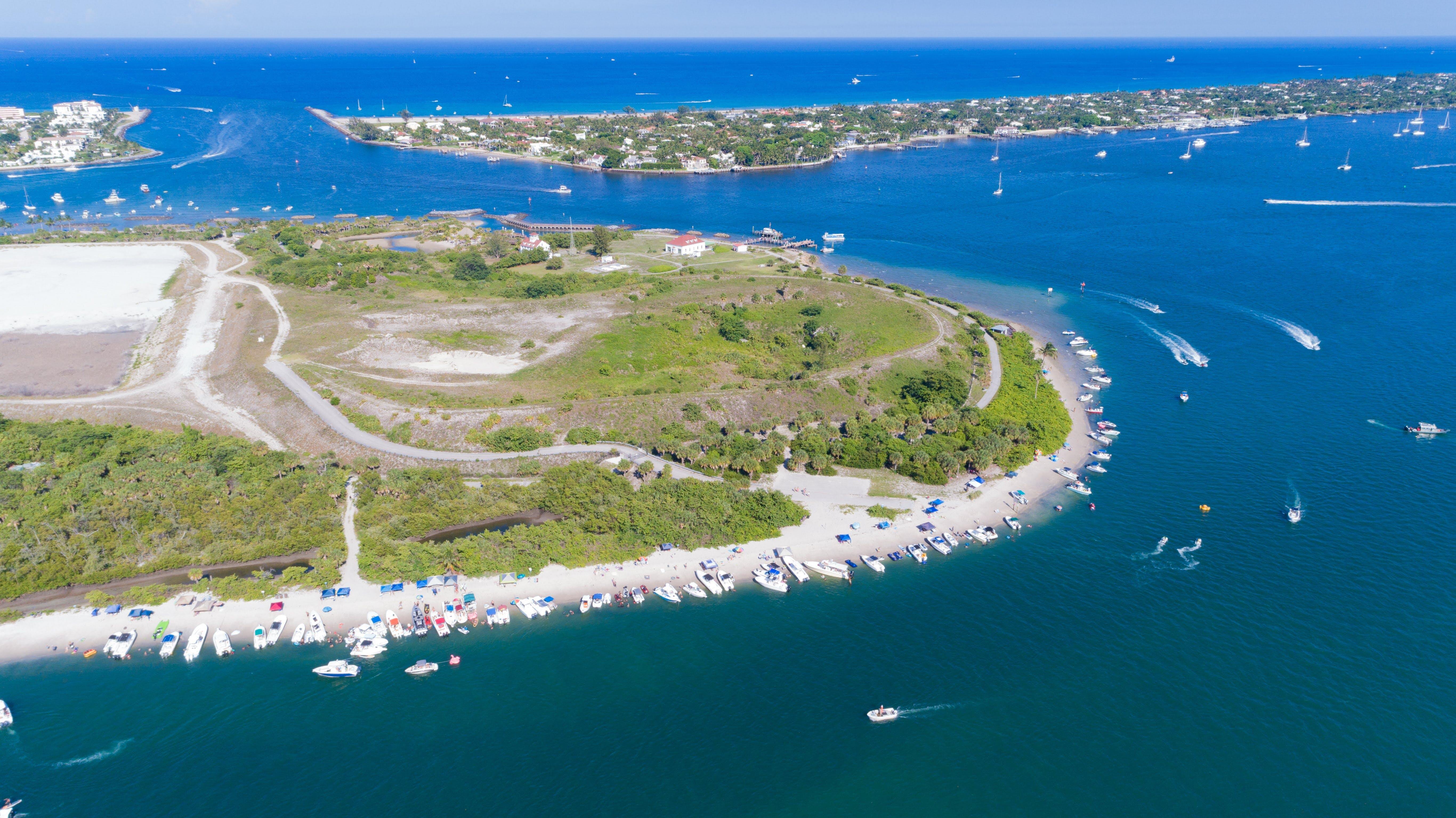 Aerial view of Peanut Island in Riviera Beach, Florida on memorial day weekend. Clear skies and blue water with plenty of boaters