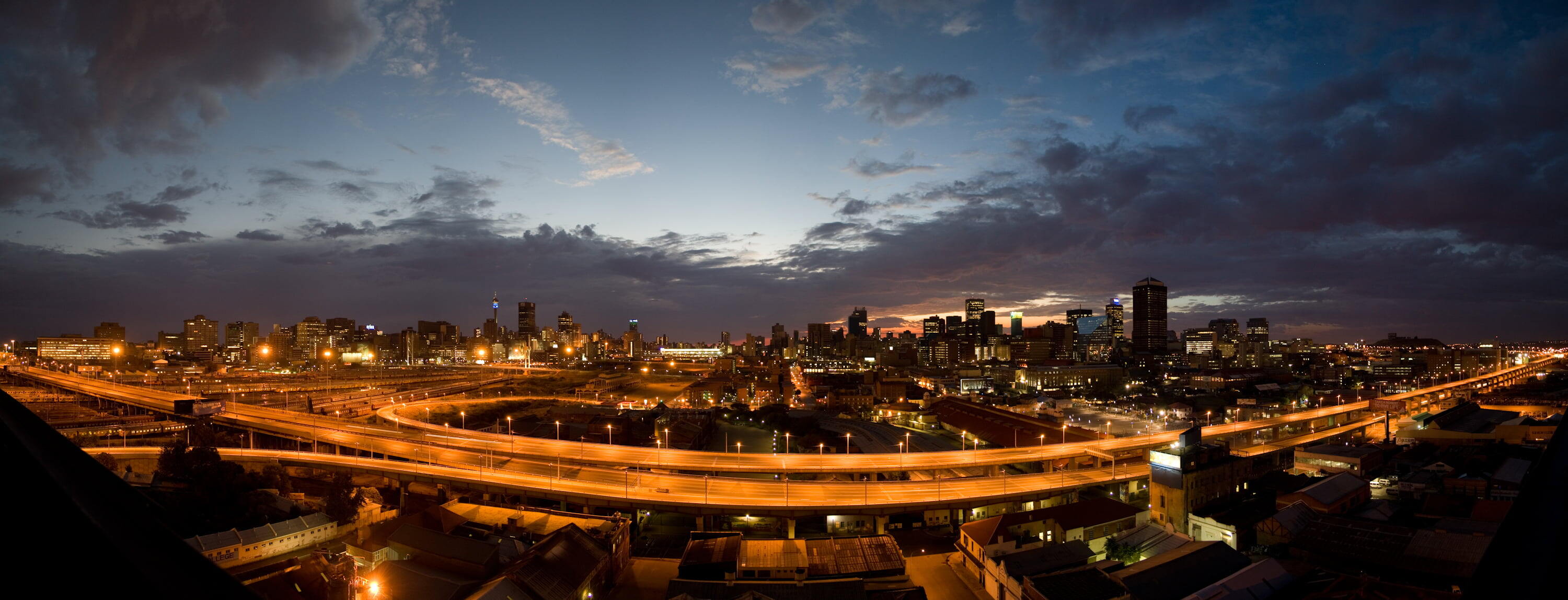 Johannesburg - Early morning sunrise over the city of Johannesburg, shot looking East with the M1 Highway in the foreground.