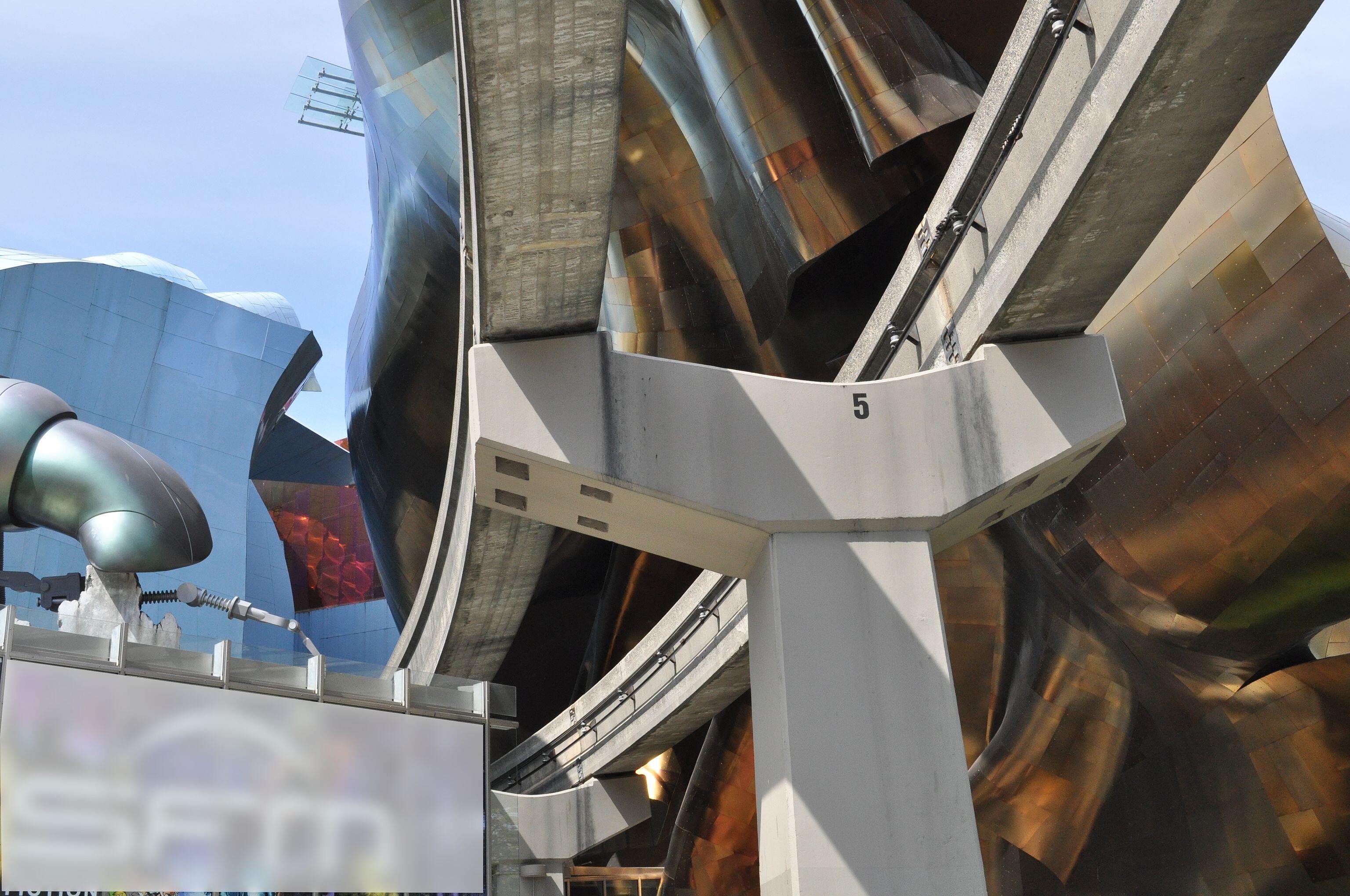 Monorail tracks enter Experience Music Project building (from 5th Avenue side), Seattle Center Seattle, Washington, USA. Gaussian blur (and a great…