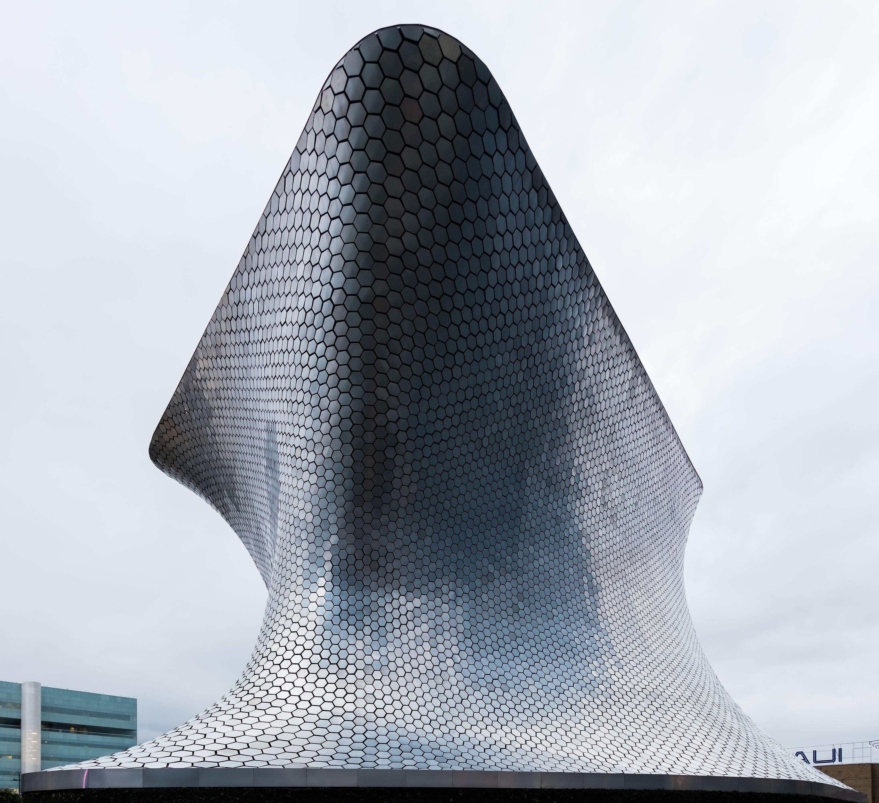 Building of the Soumaya Museum located in Plaza Carso, Nuevo Polanco area, Mexico City, Mexico. The building, work of architect Fernando Romero, was inaugurated in 2011 by the former president Felipe Calderón Hinojosa. The museums belongs to the homonymous cultural institution, a non-profit organisation dedicated to the maintenance, exposition, research and difusion of the art collection of the Carlos Slim Foundation. The museum's name honours the memory of Soumaya Domit, wife of the museum's founder,…