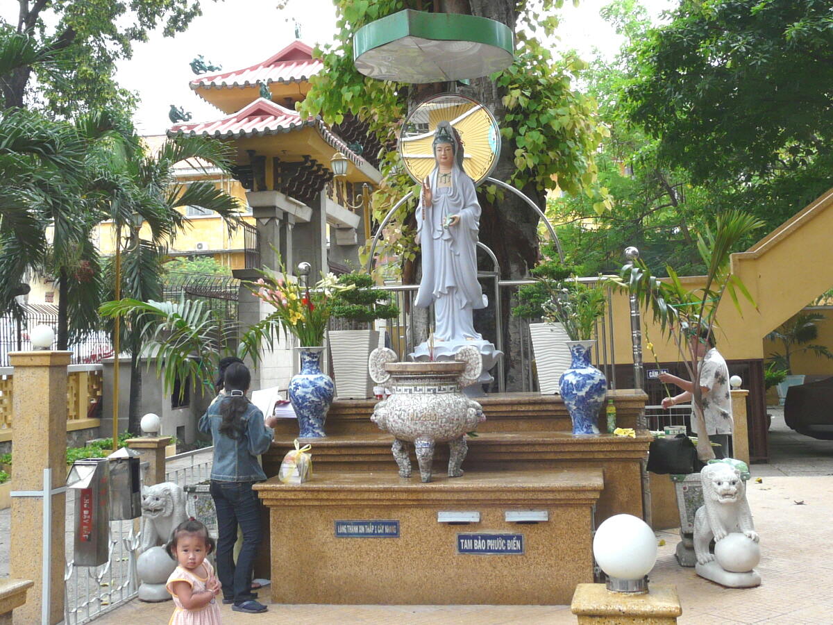 This Chinese style statue of the bodhisattva Quan Am stands in the courtyard at Xa Loi Pagoda, Ho Chi Minh City.