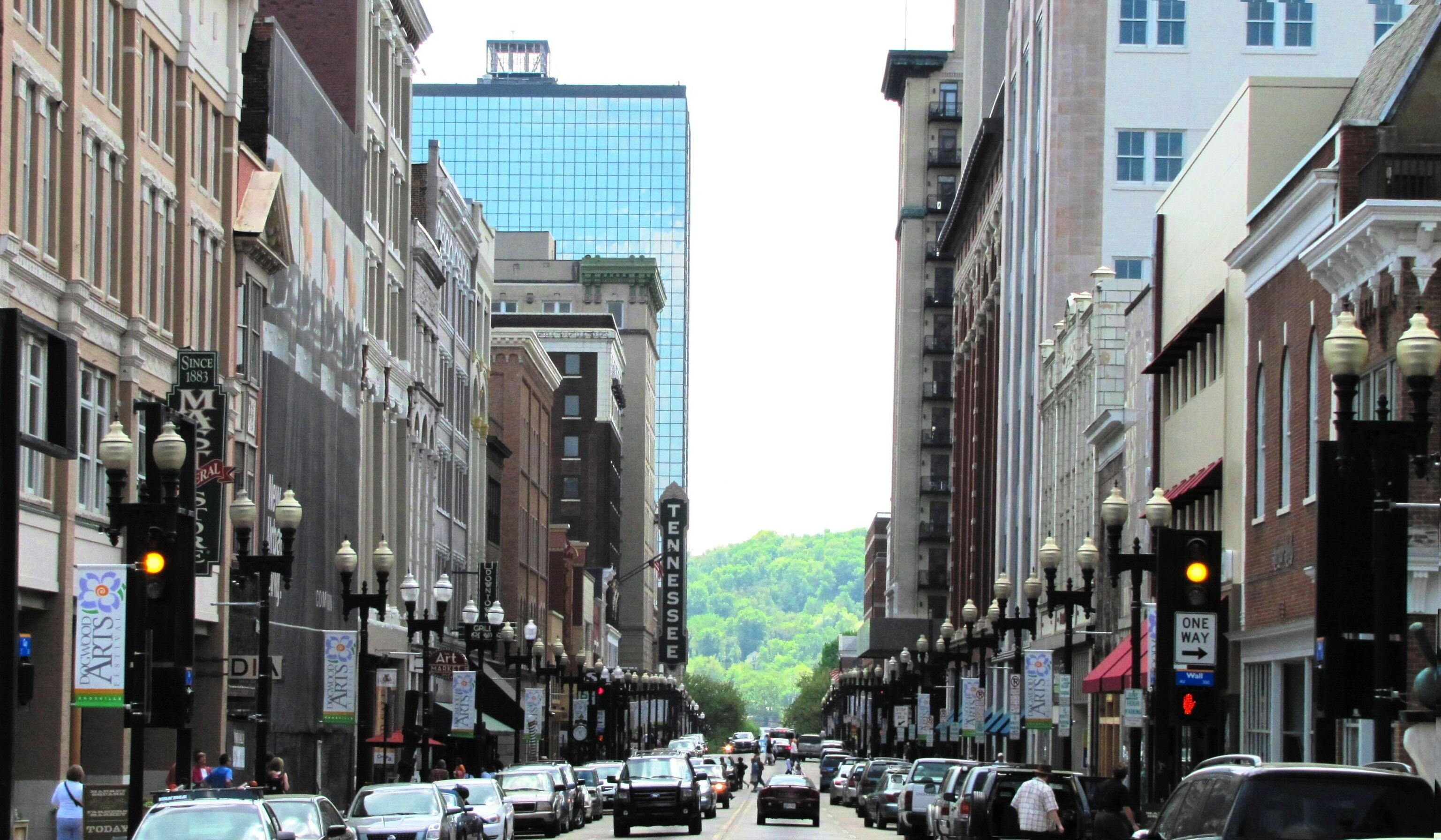 Knoxville - View south along South Gay Street in Knoxville, Tennessee, USA.  Several of the buildings pictured are contributing buildings in the NRHP-listed Gay Street Commercial Historic District.  The Plaza Tower (First Tennessee Plaza), Knoxville's tallest building, rises in the distance on the left.  The intersection of Gay and Wall is on the right.